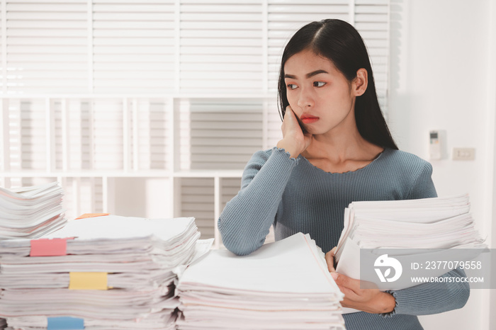 Female Employee woman hands working and searching in Stacks paper files.