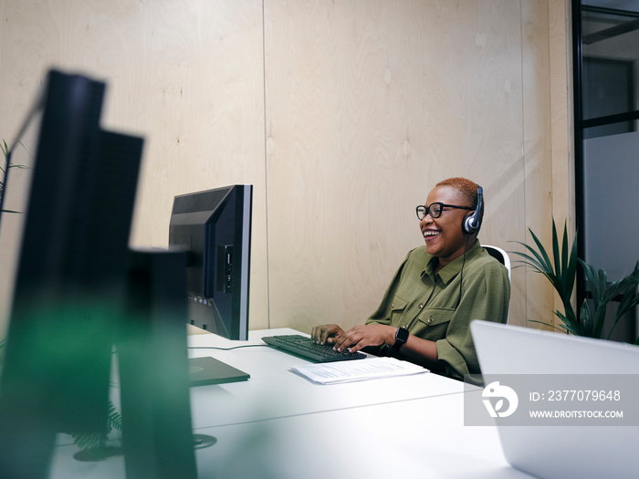 Woman using computer in office