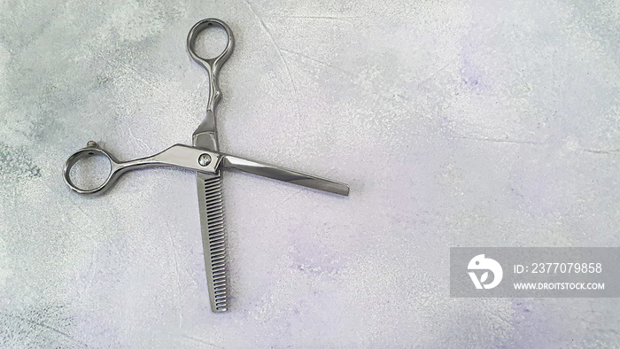 Special hairdressing scissors and comb. Professional equipment.