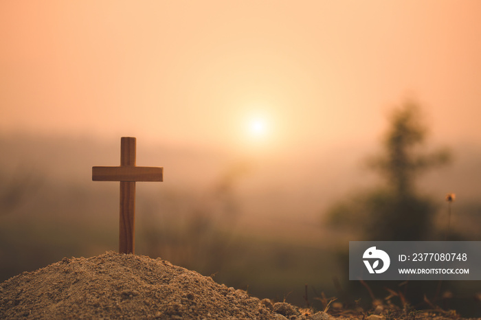 Crucifixion Of Jesus Christ. Christian wooden cross at Sunset. Jesus Christ cross. Easter, resurrection concept.