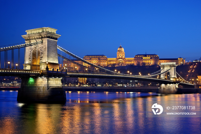 The Széchenyi Chain bridge, spanning over Danube river connecting Buda and Pest, the two sides of Budapest city, Hungary. In the background, the Royal Palace.