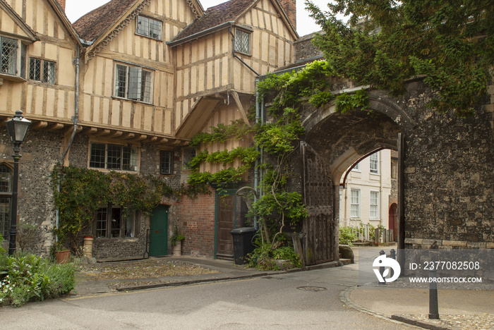 Half timbered medieval houses just inside the King’s Gate in the ancient city walls of Winchester, Hampshire, UK