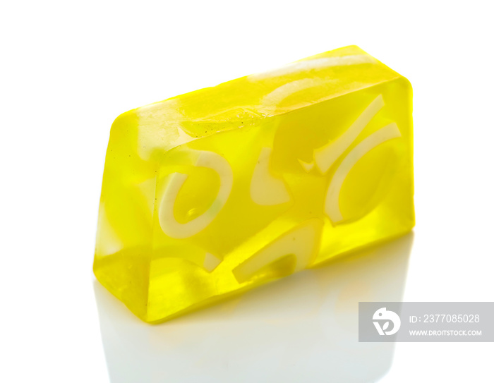 Handmade soap bar with lemon isolated on a white background.