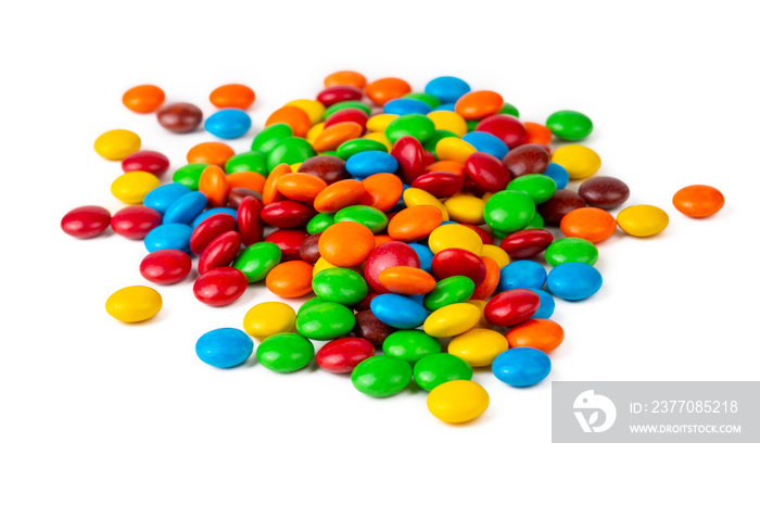 A Pile of Rainbow Colored Candy Coated Chocolate Buttons Isolated