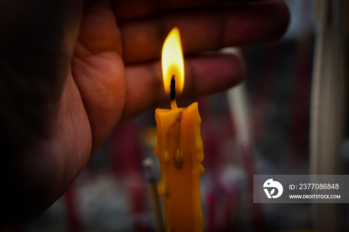 Light a candle to worship is the belief of Buddhism.