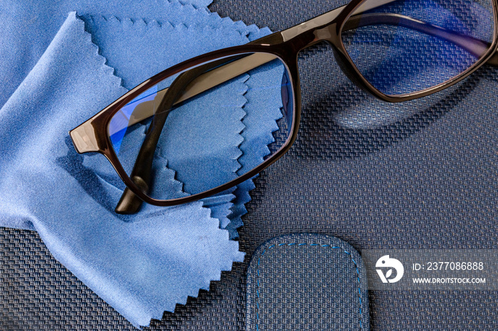 pair of eyeglasses with a microfiber cleaning cloth, cleaning glasses with microfiber cloth