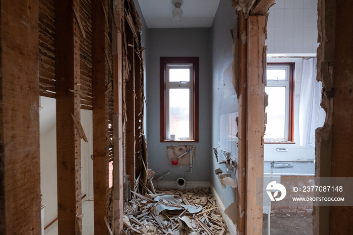 Building work underway in a suburban Edwardian house in Pinner, northwest London UK. The builder is taking the house back to brick.