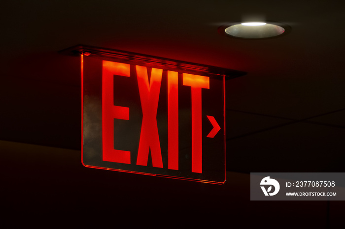 a red lit exit sign