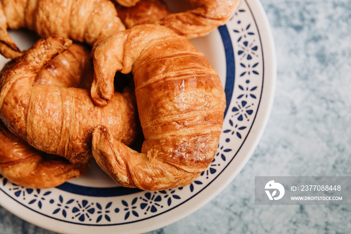 vintage plate with medialunas, argentinian sweet croissant.