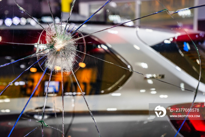 Abstract Cracked Window Glass background. Crash windshield glass of car. The broken and damaged window glass of a car background concept.