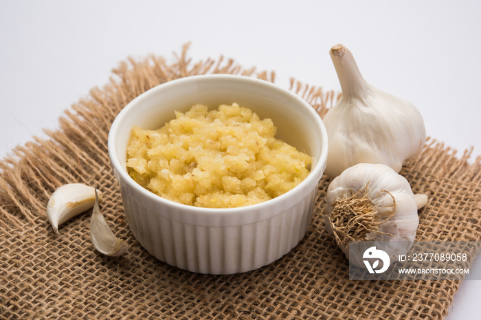 Garlic Paste or Toum or Toumya with raw garlic, isolated over white background