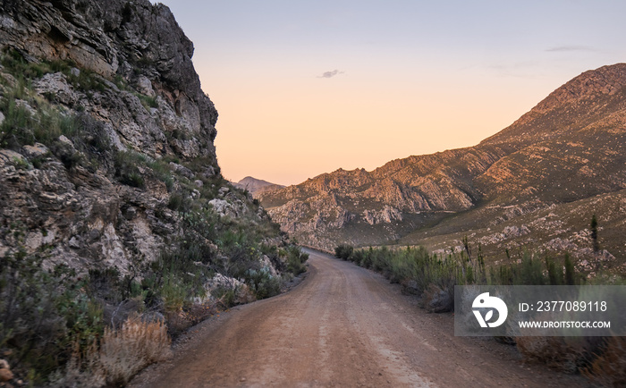 Landscape shot of Swartberg Pass dirt road during sunset in the Little Karoo Western Cape South Africa
