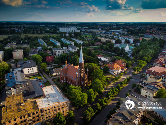 Church in small Polish casual town, Sunset in Łowicz