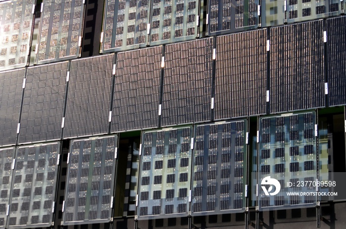 The walls of the building are tiled with solar panels.