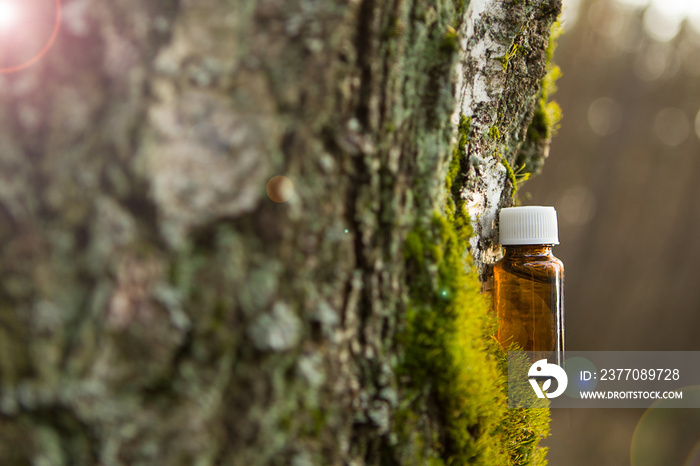 Essential oil in a small brown bottle.