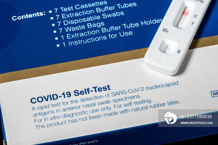 Box containing self test Covid-19 antigen tests with result showing a negative test for the coronavirus