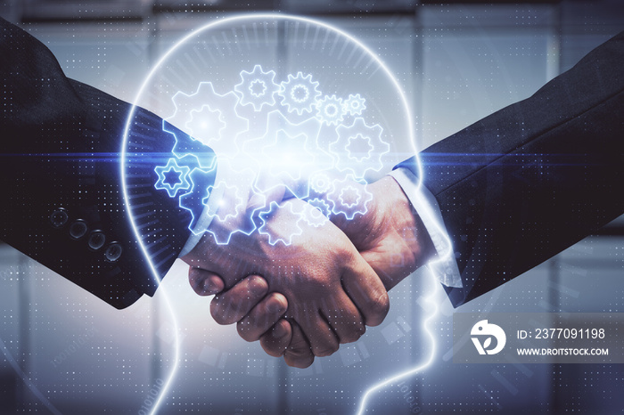 Double exposure of brain hologram and handshake of two men. Partnership in IT industry concept.