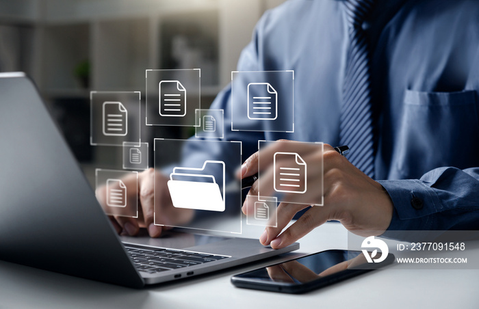 Document Management System DMS, Businessman pointing to folder and document, system used to create, store, manage, and track electronic document.