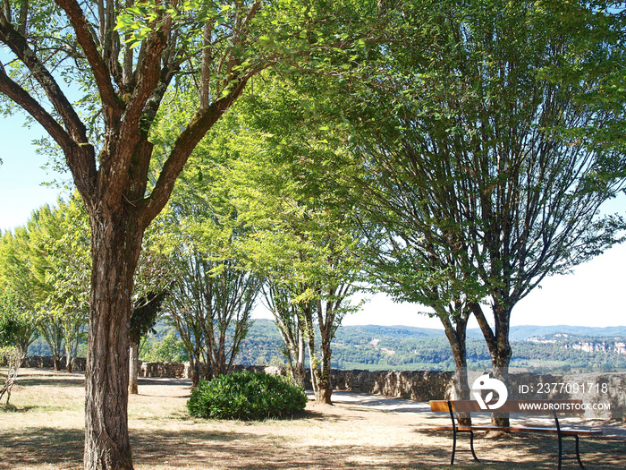 Royal Bastide of Domme on Périgord Noir. Public garden at the end of the cliff promenade offering a magnificent calm place with view on  the Dordogne valley