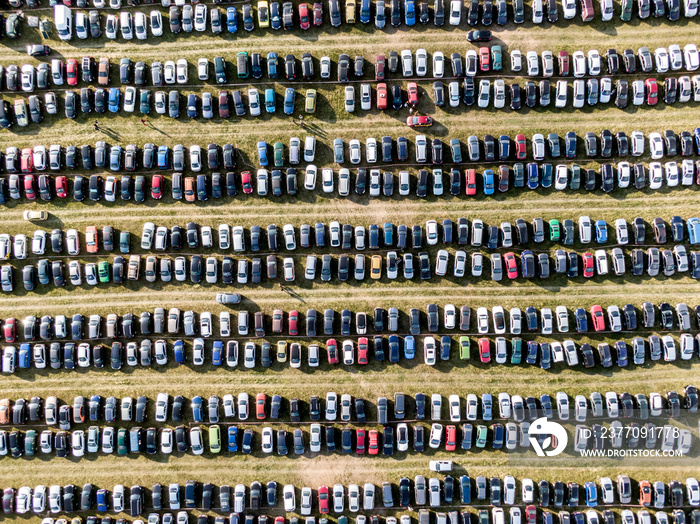 Many cars parked in the field. Car background.