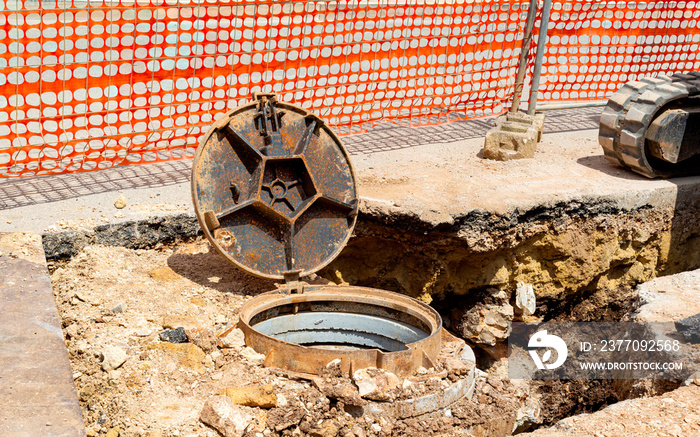 Sewer cover runneth over spilling water into