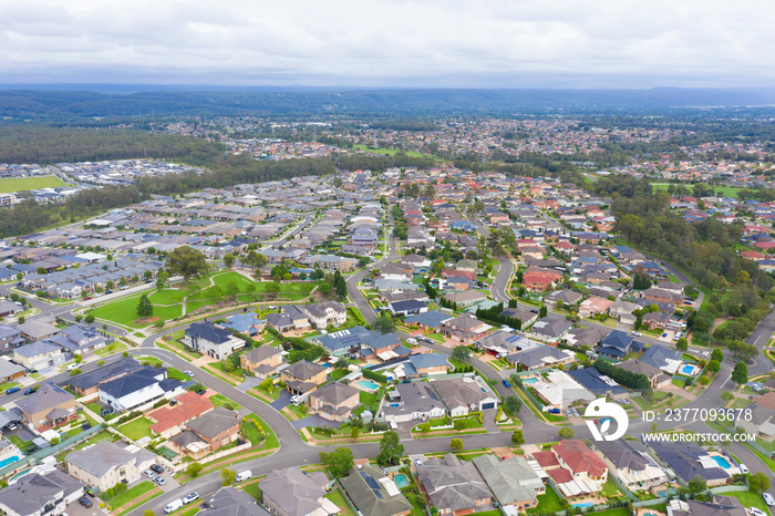 Aerial view of grey roofed houses in the suburbs