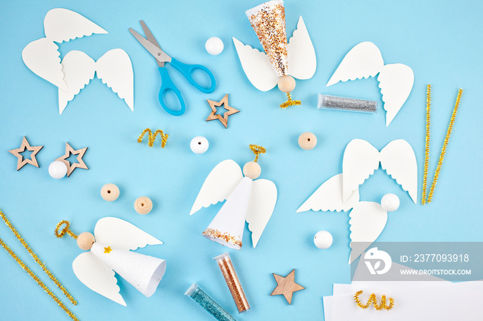 Creative hobby. DIY Christmas decoration. Process of making handmade christmas paper angels