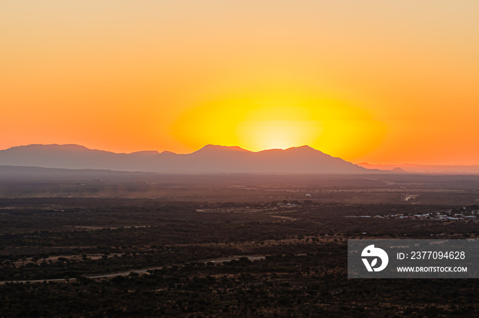 African sunset behind mountains from Otjiwarongo, Namibia