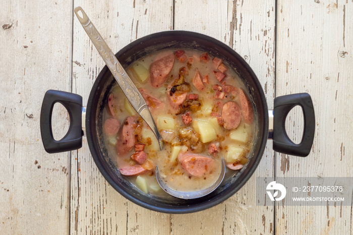 Traditional polish sour soup on wooden background