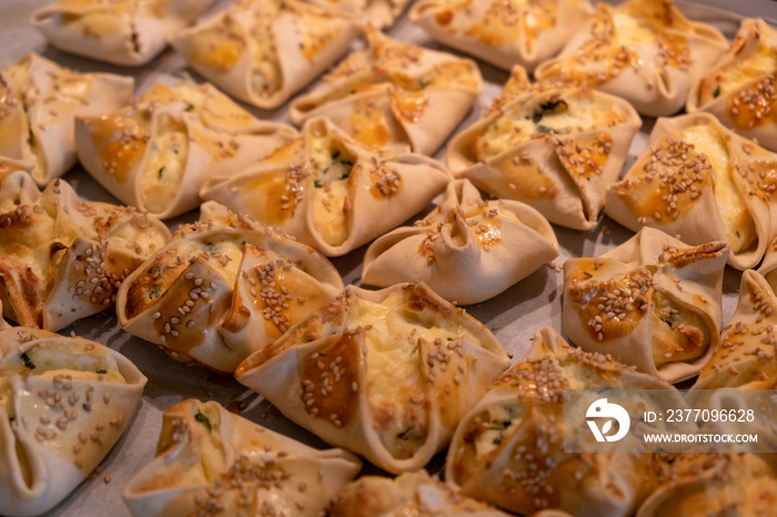 Kalitsounia kaltsounia pies traditional Cretan dough with mizithra cheese background