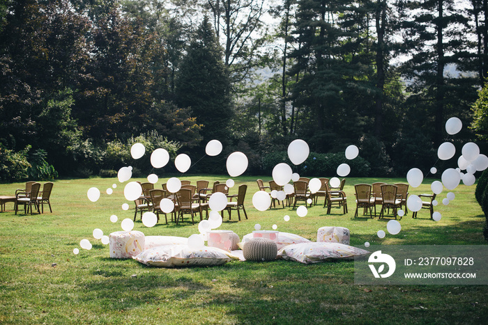 white and pink balloons installed in the garden birth for a children’s party