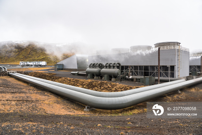 View of a Geothermal Power Plant with Big Steam Pipes on a Cloudy Day in Fall