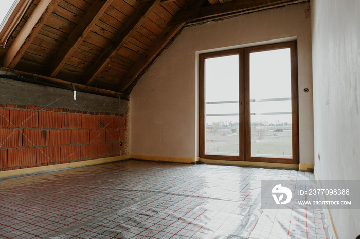 Building site, basic stage house with thermal foil for underfloor heating