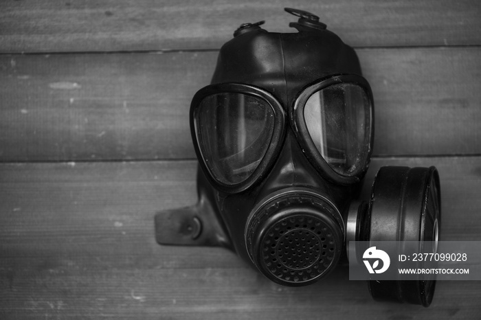 black gas mask on wood background with Black & White  Color