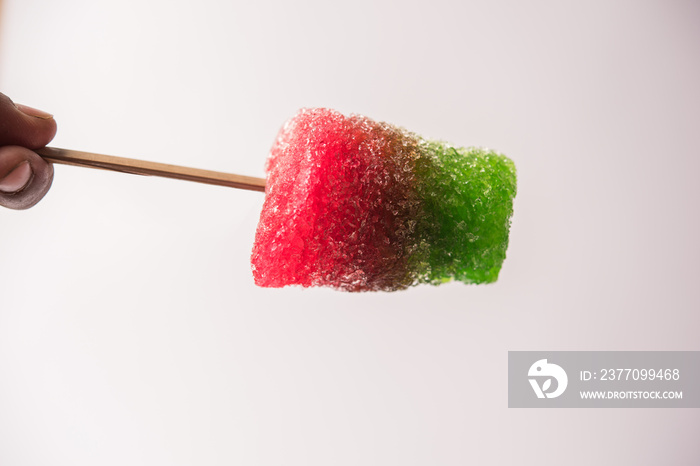 Chuski Or Baraf ka Gola also known as Ice candy, popular roadside refreshment in Indian summerin kala khatta, orange and mixed flavour