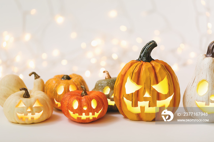 Halloween pumpkins on a shiny light background