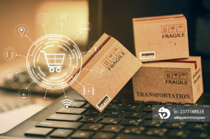 Shopping online, e-commerce concept: Cardboard boxes with icon customer network connection on keyboa