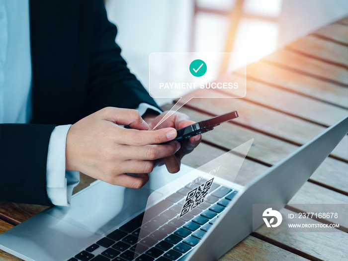Payment success notification appear on smart mobile phone in business persons hands who scan online
