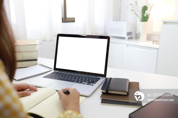 E-learning Education Internet Networking . Young businesswoman sitting at table used laptop with ins