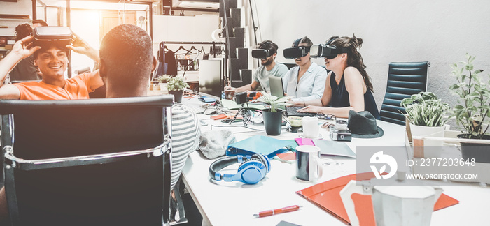 Young teamwork using virtual reality glasses in coworking creative office