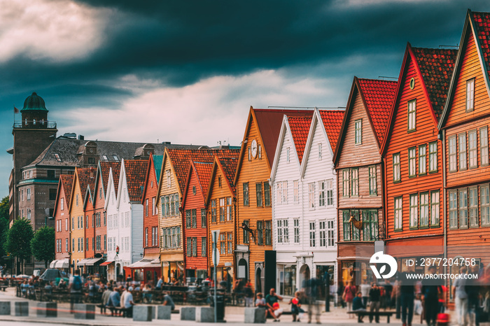 Bergen, Norway. Tourists People Visiting Historical Landmark Houses In Bryggen - Hanseatic Wharf In 