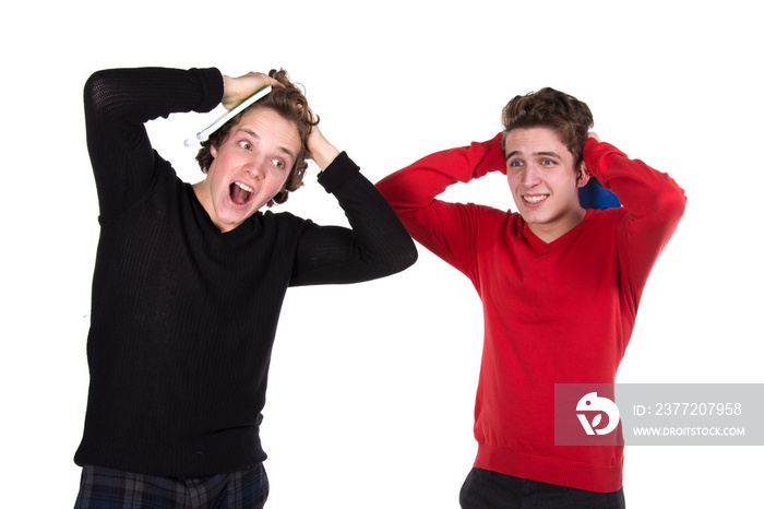 Two young attractive students. White background.