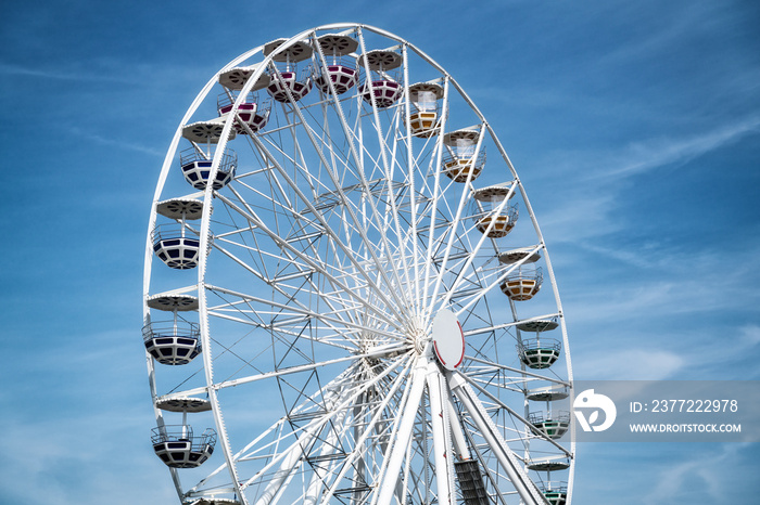 Ferris Mill, big  wheel on a background of blue sky.