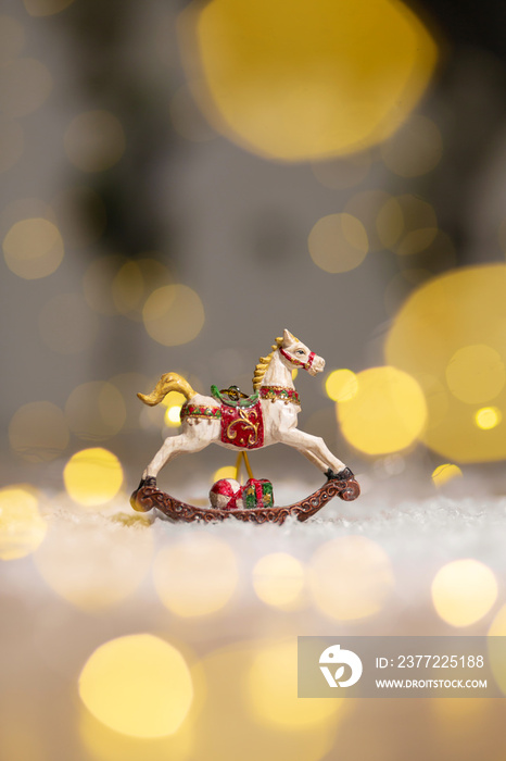 Decorative figurines of a Christmas theme. Figurine of a rocking horse. Decoration for a Christmas t