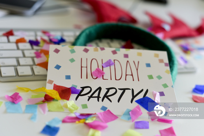 confetti and text holiday party in an office