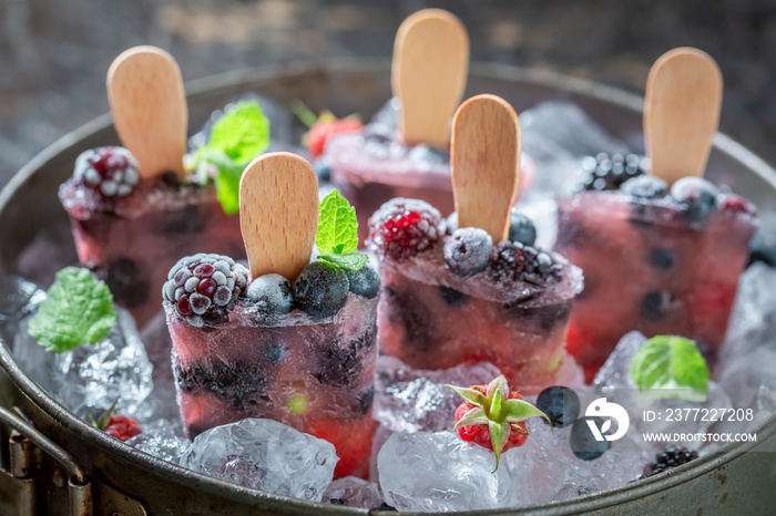 Homemade berry fruits ice cream on a stick