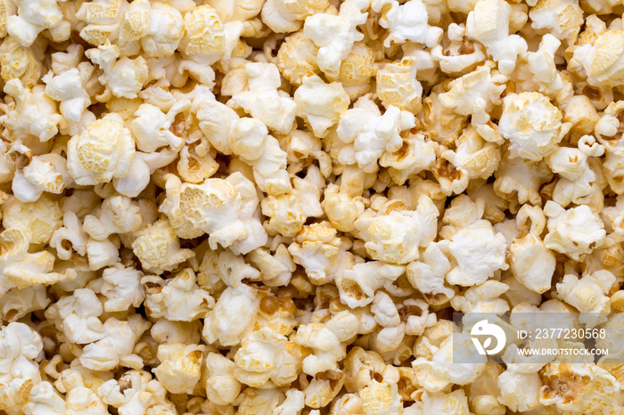 Popcorn background. Caramel sweet corn. Cinema snack.