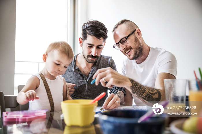 Fathers playing with daughter at home