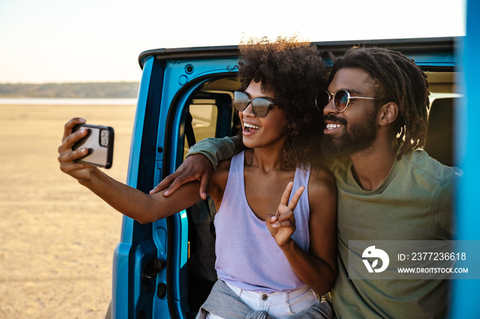 Young couple in love making selfie using smart phone