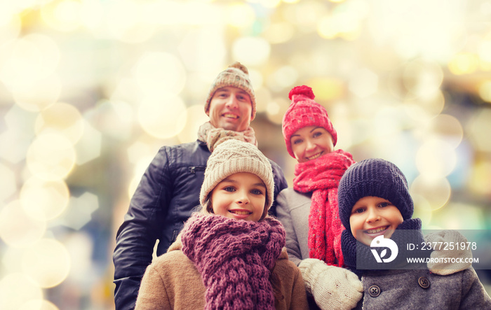 happy family in winter clothes outdoors